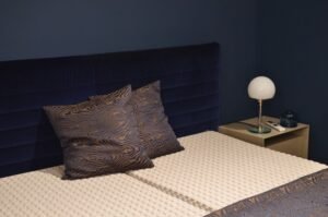 emma matras vs waterbed — Creative design of bedroom interior with bed and pillows with ornament near lamp on bedside table