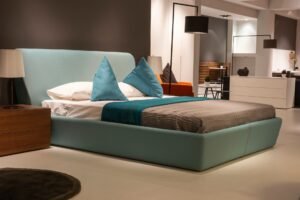 waterbed vs boxspring — Stylish and modern bedroom interior design featuring a cozy bed with teal accents.